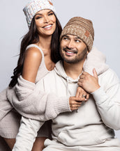 Two people wearing BELLAMI beanies